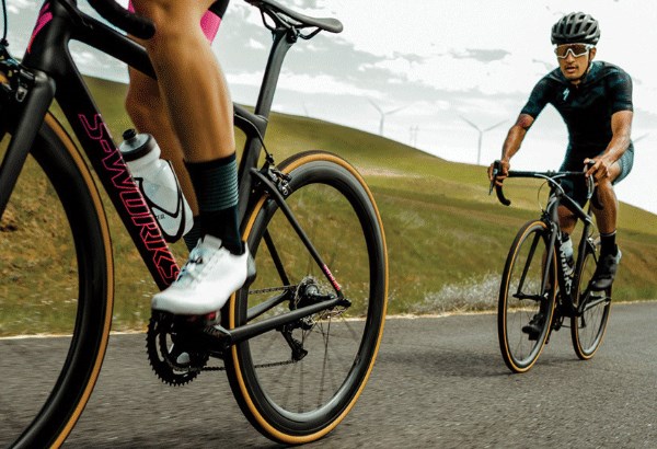 Road cyclists riding up hill