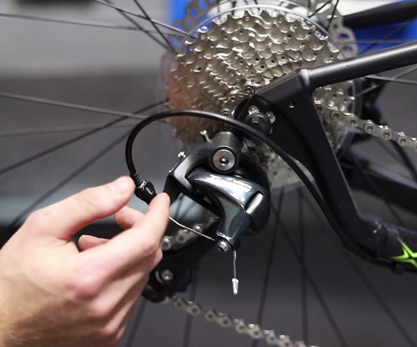 adjust the cable tension on the rear cassette of your bike