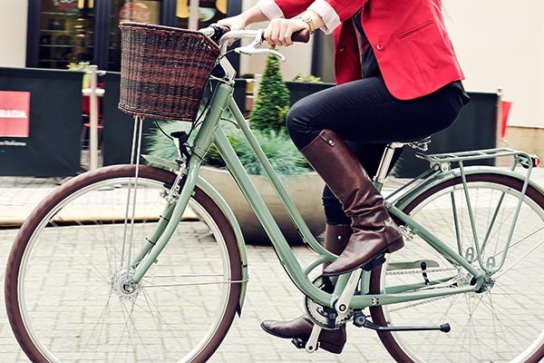 woman riding a hybrid classic bike