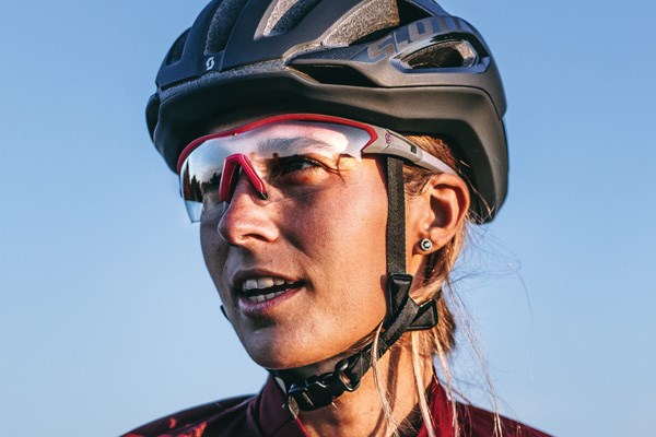 A road rider wearing a helmet with correctly adjusted straps