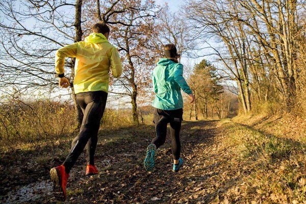 Hoka One One running shoes on sandy terrain