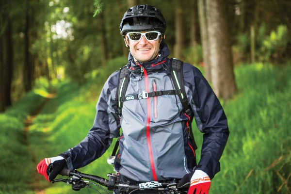 Cyclist wearing waterproof jacket