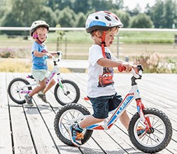 Kids riding balance bikes