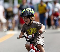 child riding a 12 inch bike