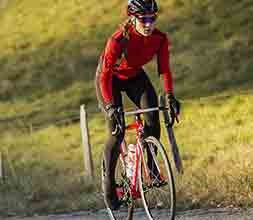 Female cyclist wearing a womens windproof jacket