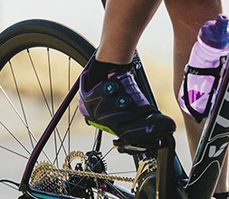Female cyclist wearing women’s road shoes