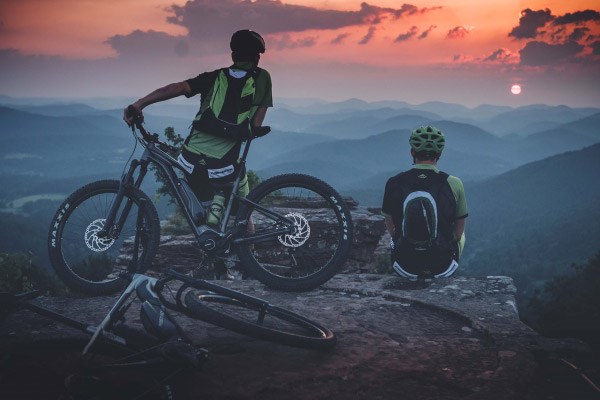 Mountain bikers watching a sunset