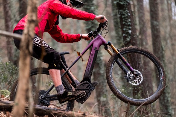 female cyclist riding an electric mountain bike