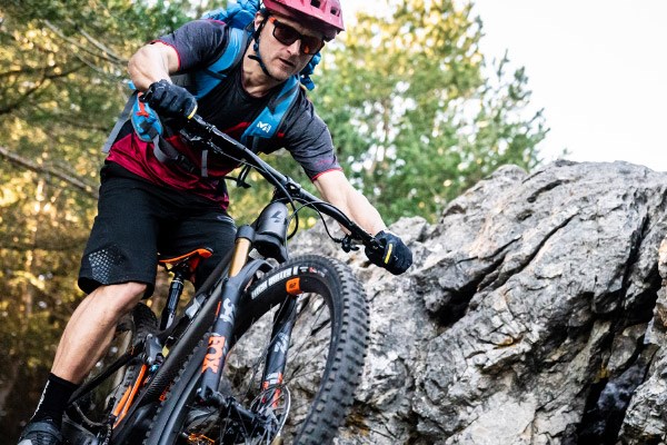 Cyclist riding a longer travel Enduro MTB