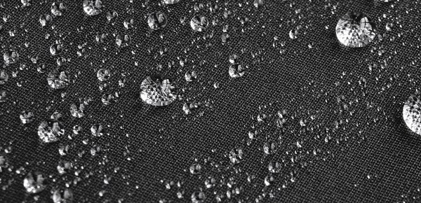 Close-up of water beading up on waterproof bib tights