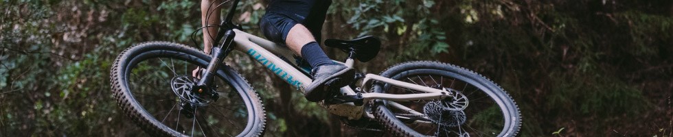 Mountain biker wearing flat MTB shoes
