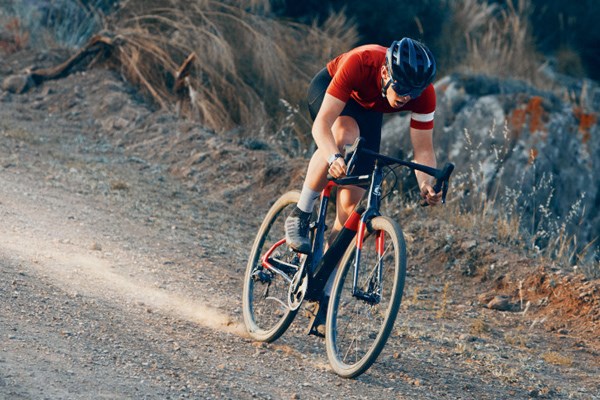 gravel bike cyclist riding fast