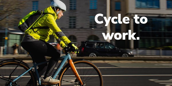 Riding an urban e-bike in a street with redd brick houses