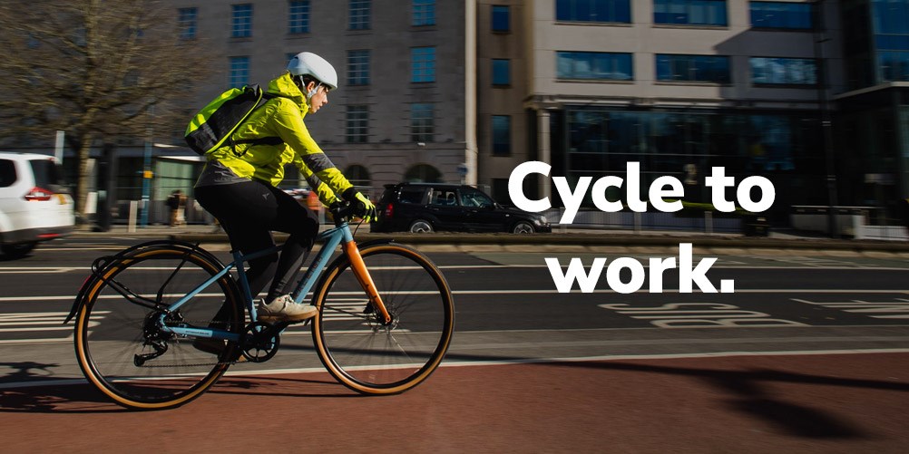 Riding an urban e-bike in a street with redd brick houses