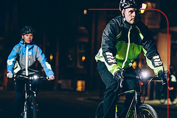 City cyclists wearing high visibility jackets