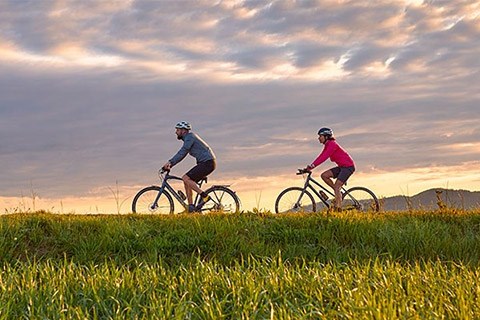 two cyclist riding with garmin edge explore 2