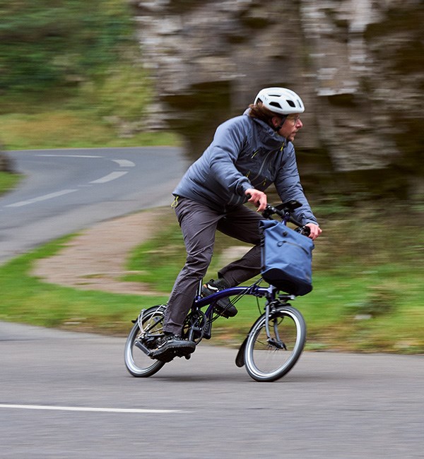 Riding a Brompton P-Line Explore on a fast country downhill roadl