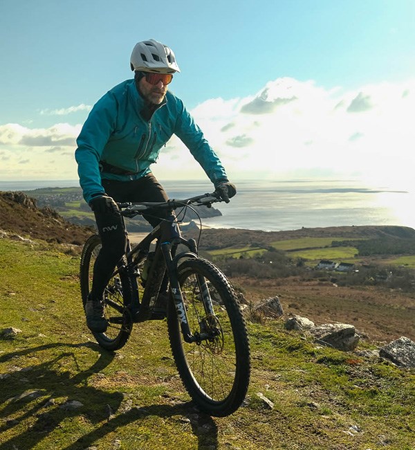 Riding the Specialized Epic 8 Evo mountain bike on a sunny winter day on the Welsh coast 