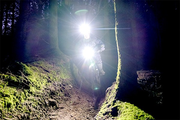 Riding in the woods at night with exposure lights