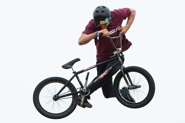 BMX rider getting some air at the skate park