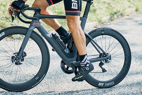 Road cyclist ridng a BMC showing off shoes