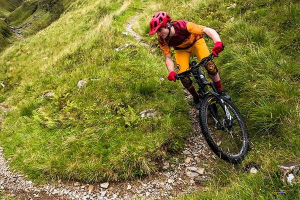 Mountainbiker riding a switch back turn