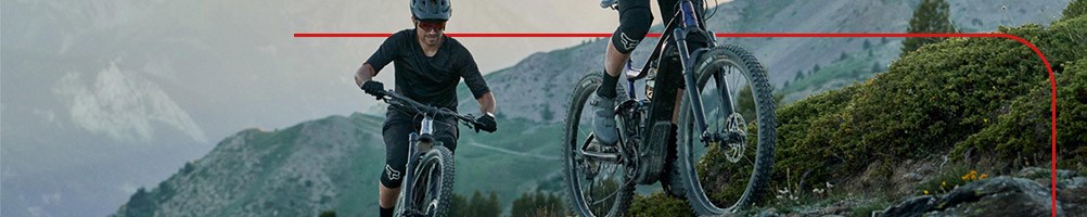 Two mountain bikers on a climb using Giant Trance X E+ E-Bikes