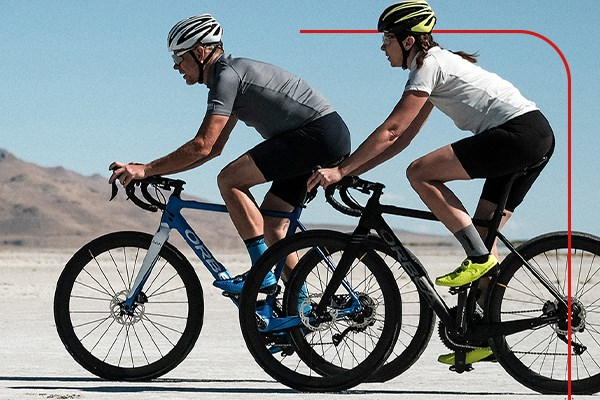 Two cyclist riding endurance road bikes through the desert