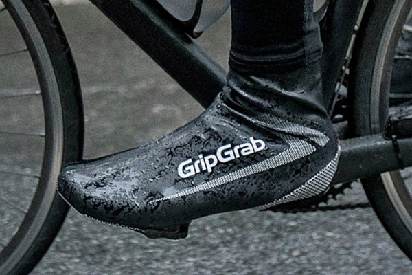 A cyclist wearing waterproof overshoes